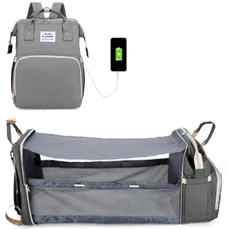 Baby diaper bag with changing station